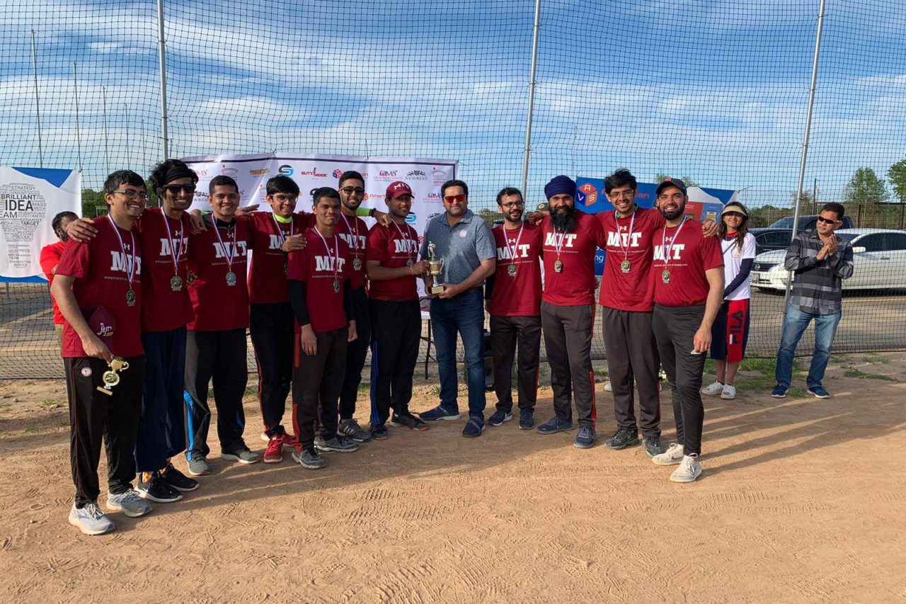 Cricket team holding trophy