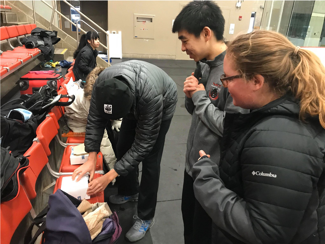 Skaters taking a well-deserved rinkside snack break