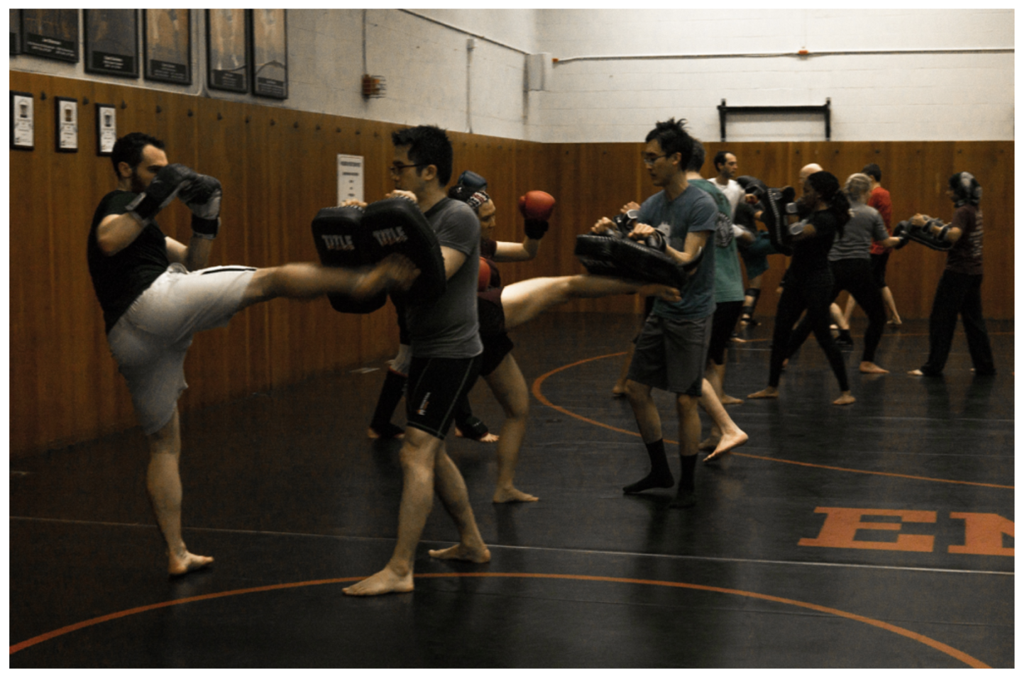 Students kicking pads