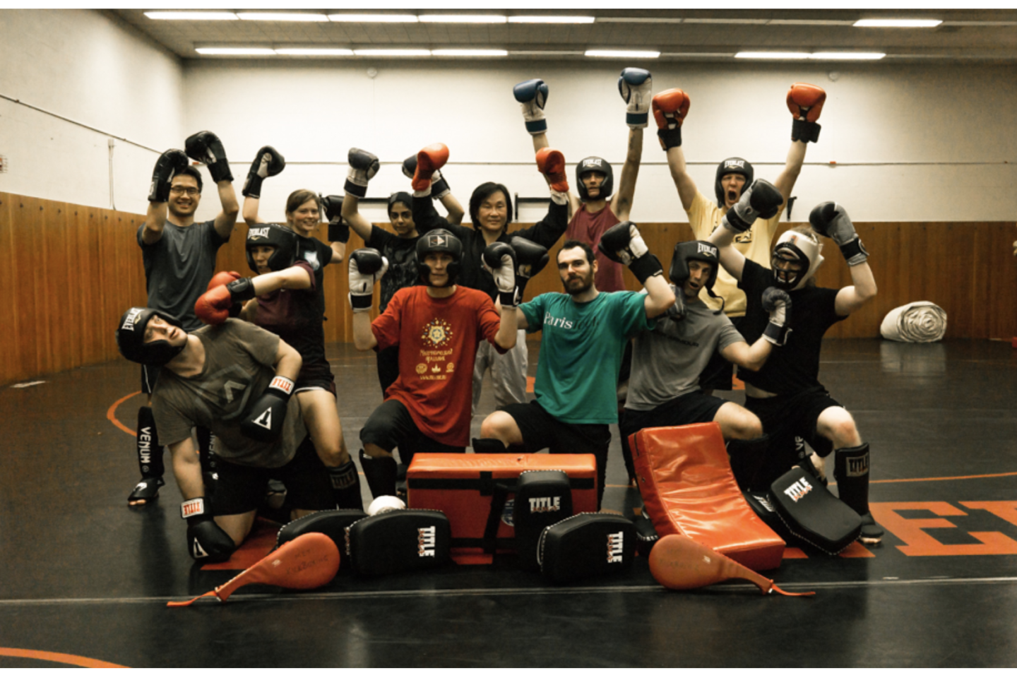 Group kickboxing picture with gloves and headgear on