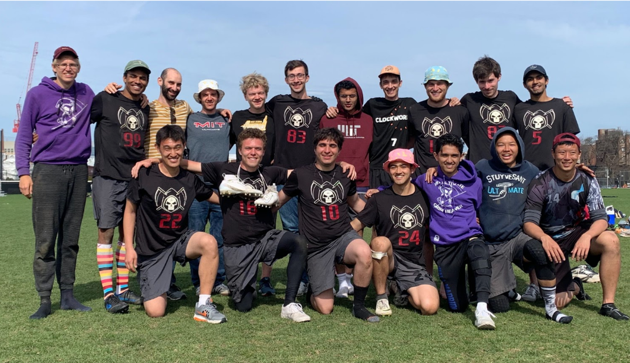 Team posing on Briggs Field