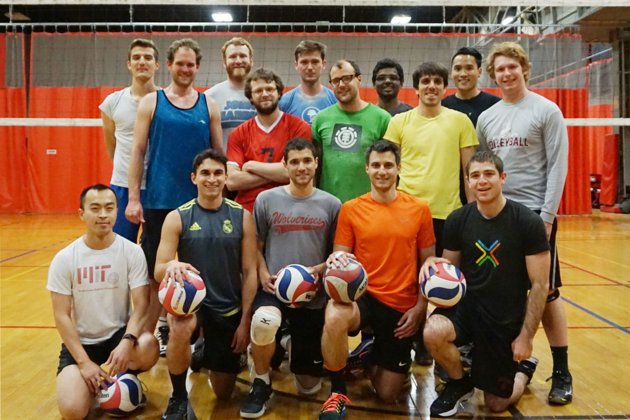 Team posing in Rockwell with volleyballs