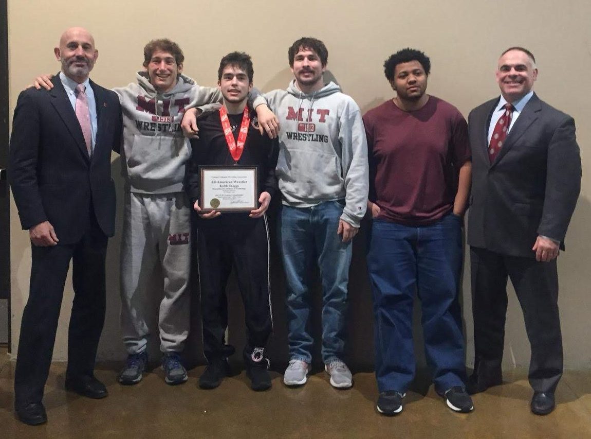 4 wrestlers with coaches